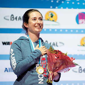 Maureen Beck accepts a gold medal in climbing.